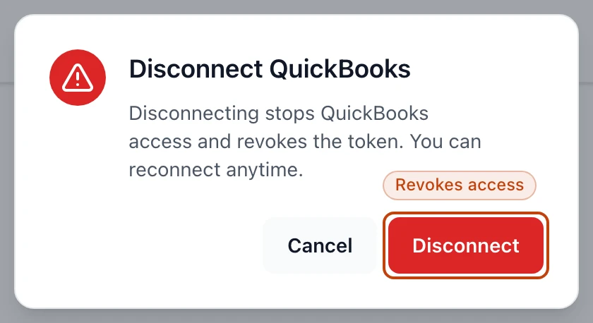 The confirm dialog before disconnecting QuickBooks, warning that it revokes access and that you can reconnect anytime.